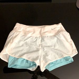Nike running DRI-FIT shorts. Size XS. White and turquoise.